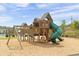 Community playground with playset and swings at 4745 Billow Sw Way, Mableton, GA 30126