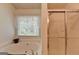 Clean bathroom with bathtub, shower, and window at 770 Dunagan Forest Dr, Lawrenceville, GA 30045