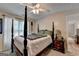 Bedroom with a wooden bed frame and ample natural light at 770 Dunagan Forest Dr, Lawrenceville, GA 30045