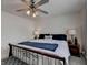 Comfortable bedroom with king-size bed and ceiling fan at 770 Dunagan Forest Dr, Lawrenceville, GA 30045