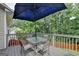 Deck with table, chairs, umbrella, and grill at 770 Dunagan Forest Dr, Lawrenceville, GA 30045