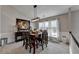 Elegant dining room with a wood table, six chairs, and a built-in bench at 770 Dunagan Forest Dr, Lawrenceville, GA 30045