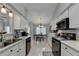 Modern kitchen with white cabinets, stainless steel appliances, and ample counter space at 770 Dunagan Forest Dr, Lawrenceville, GA 30045