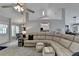 Relaxing living room with a sectional sofa and a view of the dining area at 770 Dunagan Forest Dr, Lawrenceville, GA 30045