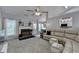 Light-filled living room with vaulted ceilings, a fireplace, and sectional sofa at 770 Dunagan Forest Dr, Lawrenceville, GA 30045