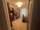 Large walk-in closet with custom shelving and a workspace at 770 Dunagan Forest Dr, Lawrenceville, GA 30045