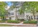 Three-story brick townhouses with lush landscaping at 9972 Ashton Old Rd, Douglasville, GA 30135