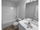 Clean bathroom with a shower/tub combo, toilet and vanity at 220 Mountain Way, Covington, GA 30016