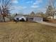 Single story home with attached garage and well-maintained lawn at 220 Mountain Way, Covington, GA 30016