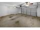 Two-car garage with ceiling fans and freshly painted walls at 220 Mountain Way, Covington, GA 30016