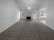 Spacious living room with gray carpeting and a fireplace at 220 Mountain Way, Covington, GA 30016