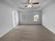 Spacious main bedroom with carpet flooring and two windows at 220 Mountain Way, Covington, GA 30016