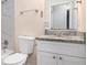 Bathroom with granite countertop, white vanity, and marble shower at 3901 W Wood Path, Stone Mountain, GA 30083