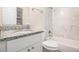 Bathroom with granite vanity and tiled tub at 3901 W Wood Path, Stone Mountain, GA 30083