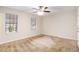 Well-lit bedroom with neutral walls and carpet flooring at 3901 W Wood Path, Stone Mountain, GA 30083