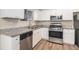 Modern kitchen, granite countertops, stainless steel appliances at 3901 W Wood Path, Stone Mountain, GA 30083