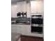 Modern kitchen featuring stainless steel appliances and granite countertops at 780 Codex Dr, Fairburn, GA 30213