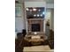 Cozy living room with a stone fireplace and large TV at 780 Codex Dr, Fairburn, GA 30213