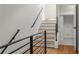 Modern staircase with metal railing leading to upper level at 105 Georgia Se Ave # 1, Atlanta, GA 30312