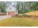 Detached garage with modern design and a landscaped yard at 1356 Deerwood Dr, Decatur, GA 30030