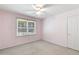 Simple bedroom with carpet flooring and ceiling fan at 1094 Plantation Ct, Villa Rica, GA 30180