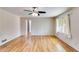 Hardwood floor bedroom with ceiling fan and window at 1094 Plantation Ct, Villa Rica, GA 30180