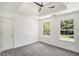 Well-lit bedroom featuring two windows and ceiling fan at 118 Bellington Dr, Mcdonough, GA 30253