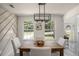 Modern farmhouse dining room with wooden table and white chairs at 118 Bellington Dr, Mcdonough, GA 30253