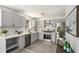 Modern kitchen with gray cabinets, white subway tile, and stainless steel appliances at 118 Bellington Dr, Mcdonough, GA 30253