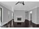 Bright living room with dark hardwood floors and a fireplace at 2510 Cumberland Se Ct, Smyrna, GA 30080