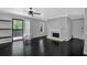 Living room featuring dark hardwood floors, fireplace and access to balcony at 2510 Cumberland Se Ct, Smyrna, GA 30080