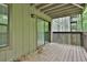 View of the wood railed patio with sliding glass door and natural lighting at 2510 Cumberland Se Ct, Smyrna, GA 30080