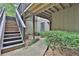 View of exterior walkway with stairs leading up to the residence surrounded by trees at 2510 Cumberland Se Ct, Smyrna, GA 30080