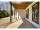 Covered back patio with wood ceiling and view of the backyard at 4382 Benfield Se Way, Smyrna, GA 30080