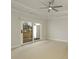 Bright bedroom featuring a fan, neutral color palette, and sliding glass doors to the deck at 4382 Benfield Se Way, Smyrna, GA 30080