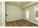 Open-concept dining area with hardwood floors, large windows, and a modern light fixture, creating a warm and inviting space at 4382 Benfield Se Way, Smyrna, GA 30080