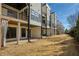 Back exterior view of the property with patios and a grassy area at 4382 Benfield Se Way, Smyrna, GA 30080