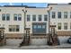 Townhome exterior with brick and white paint and attached garages at 4382 Benfield Se Way, Smyrna, GA 30080