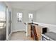 A hallway with a mini-fridge and wine-rack cabinet, leading to sliding glass doors at 4382 Benfield Se Way, Smyrna, GA 30080