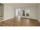 Spacious living room with hardwood floors, neutral paint, and an open layout at 4382 Benfield Se Way, Smyrna, GA 30080