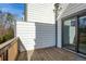 A relaxing patio with wood floors, a siding wall, and a glass sliding door to go back inside the house at 4382 Benfield Se Way, Smyrna, GA 30080