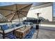 Inviting rooftop deck featuring comfortable seating, an umbrella, and a heater at 4382 Benfield Se Way, Smyrna, GA 30080