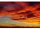 A breathtaking vibrant sunset with red and orange clouds above a distant skyline at 4382 Benfield Se Way, Smyrna, GA 30080