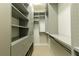 Walk-in closet with custom shelving and drawer storage at 4382 Benfield Se Way, Smyrna, GA 30080