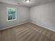 Well-lit bedroom with neutral walls and carpet at 890 Navajo Trl, Covington, GA 30016