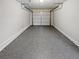 Attached garage with freshly coated floor at 890 Navajo Trl, Covington, GA 30016