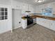 Galley kitchen with white cabinets and stainless steel appliances at 890 Navajo Trl, Covington, GA 30016