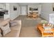 Virtually staged living room features a neutral color palette and ample natural light at 890 Navajo Trl, Covington, GA 30016