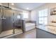 Elegant bathroom with a soaking tub and walk-in shower at 145 Lost Cove Sw Dr, Atlanta, GA 30331