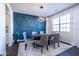 Elegant dining room featuring a statement wall and modern chandelier at 145 Lost Cove Sw Dr, Atlanta, GA 30331